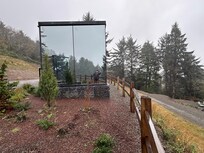 Side view of a mirrored cabin.