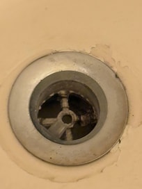Black hair in the drain.