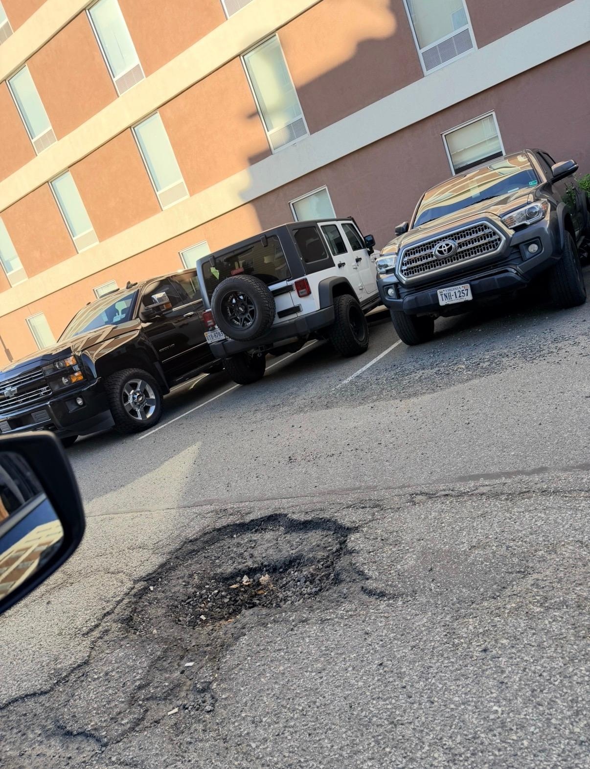 Huge pothole in parking lot 