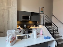 View of the kitchen and stairs to the upstairs bedroom and bathroom, which were fantastic.