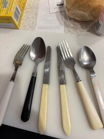 Cutlery with food still on them