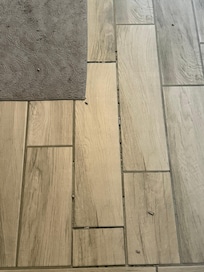 Grout and stained bathroom rugs