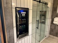Awesome beer fridge in bathroom. One of two in the room!!