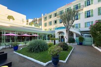Main entrance and courtyard. There's a two-lane, low-speed road between the hotel and the beach. Very easy access.