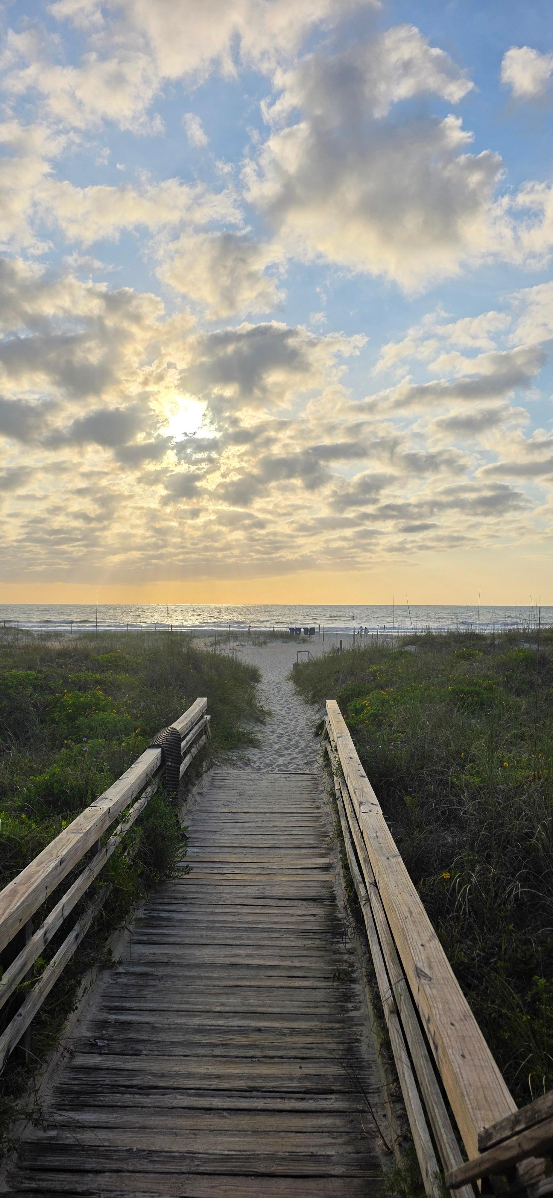 walking on the boardwalk to the beach