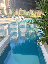 Murky pool water at swim up bar.