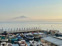 View from balcony across Bay of Naples to Vesuvius