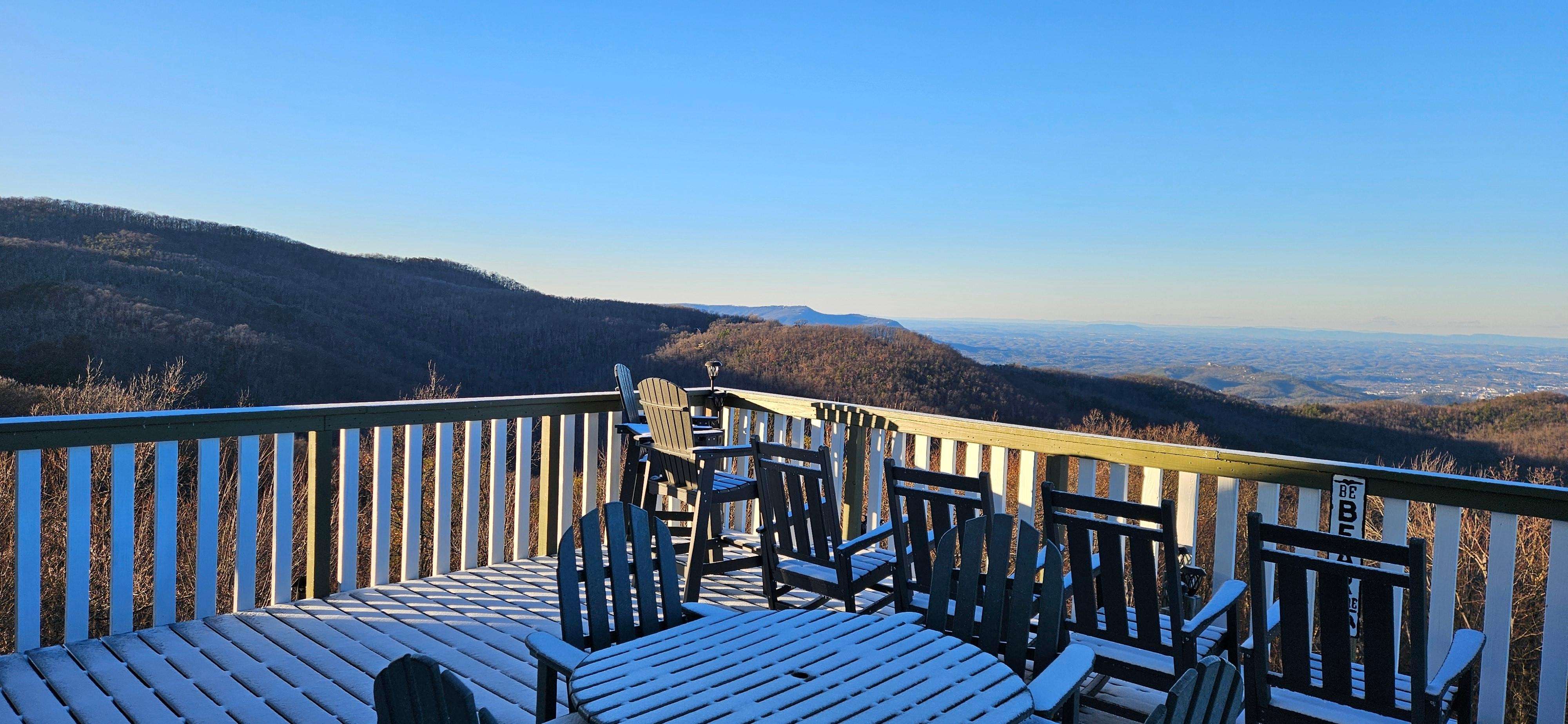 View from the back door across the snow covered deck