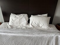 Crumbled pillows encountered on the bed the same day as noted above.
