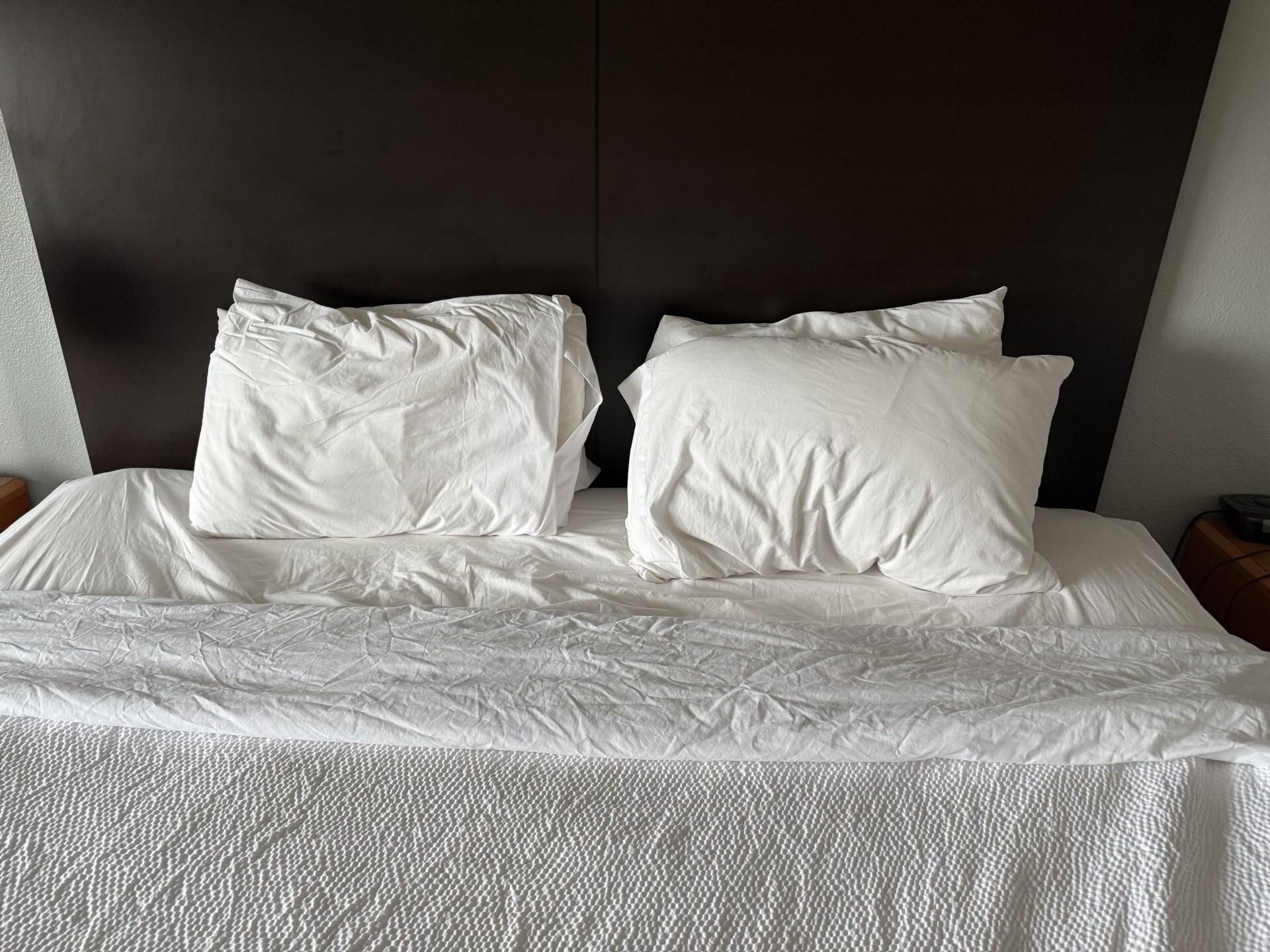Crumbled pillows encountered on the bed the same day as noted above. 
