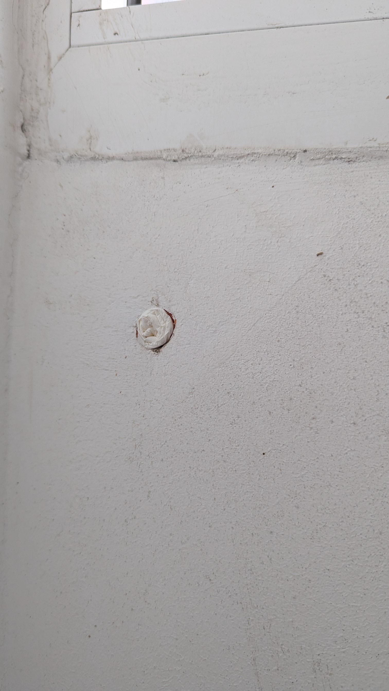 A hole in the wall - I filled it with paper to stop bugs and cold from coming in.