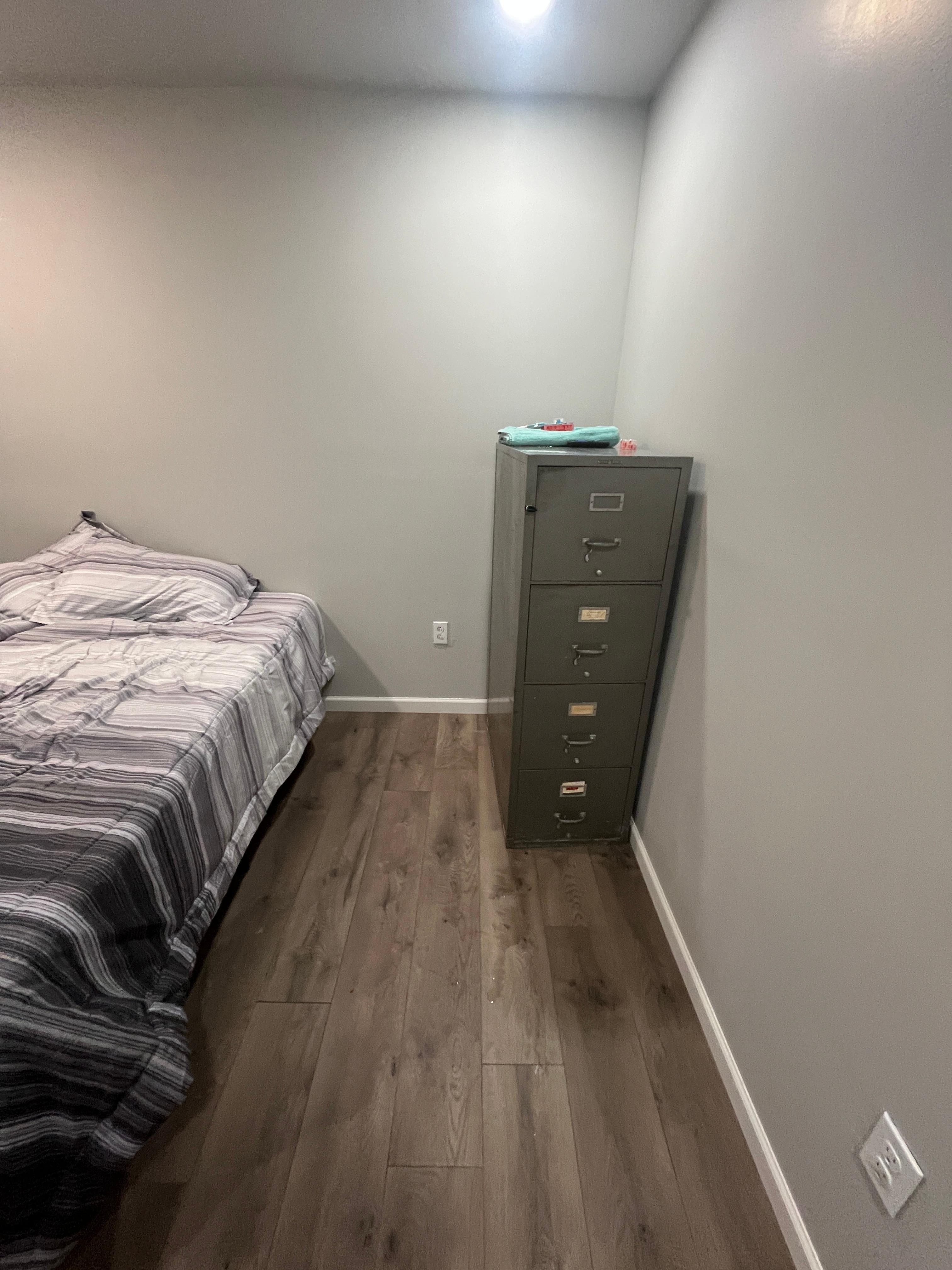 I was asked to excuse the file cabinet. “It’s heavy”