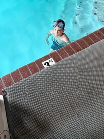 Grumpy grandson doesnât want to leave the pool.