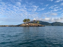 A view of the thermal swimming pool with the beautiful natural landscape behind it.