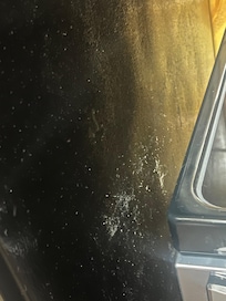 Outside of the fridge with dust, dirt and hair