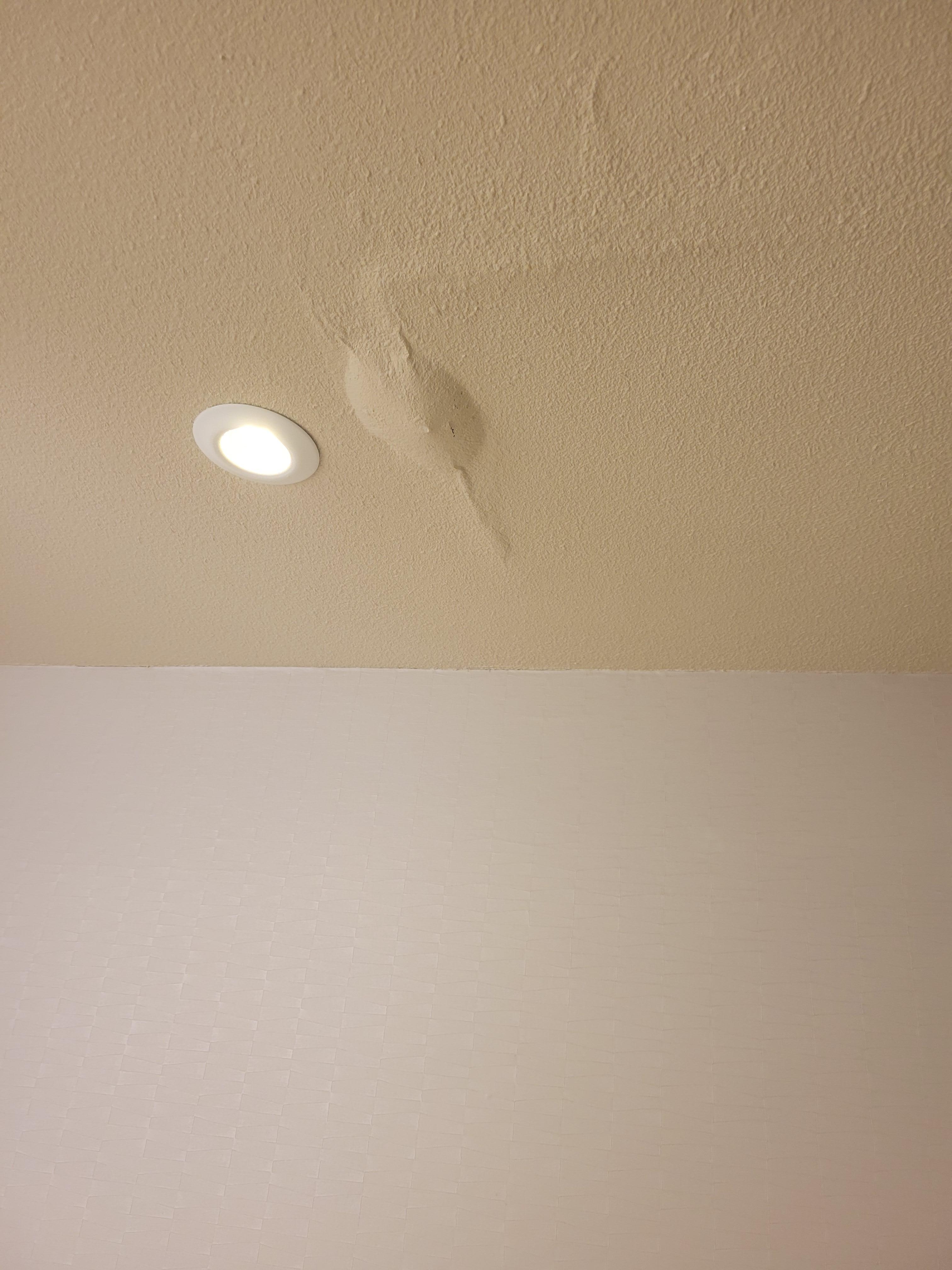 water damage and leak over the bathtub.