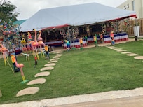 The covered area is the open bar and restaurant. Nice area surrounding the pool.