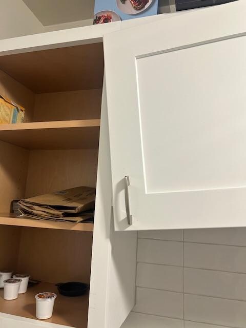 One of many cabinets that fall when another cabinet is opened.