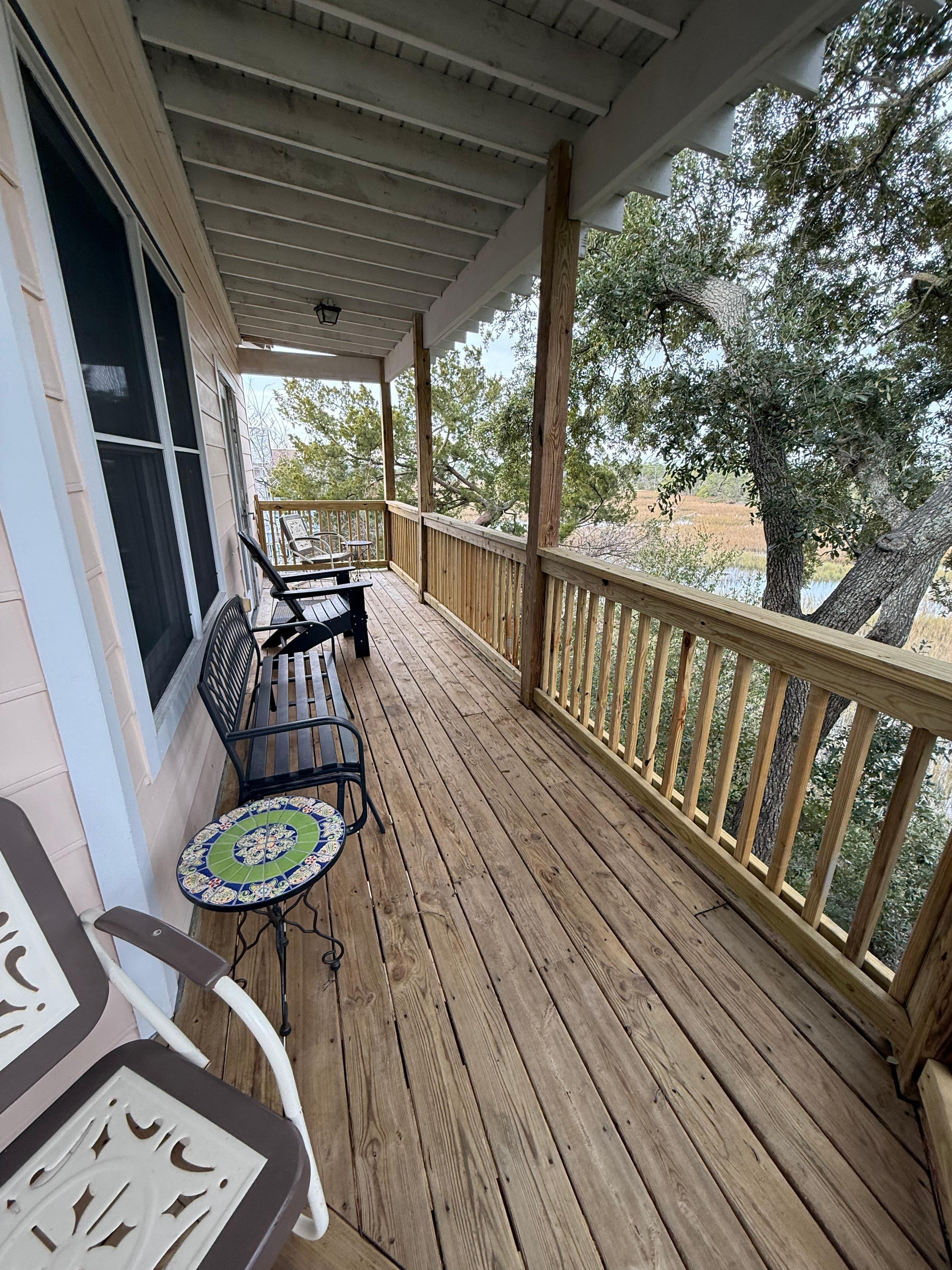 3rd level deck seating to the left. Just outside of Sitting room area with the double bed. 