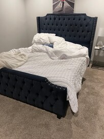 Bedroom with previous renters linen on it