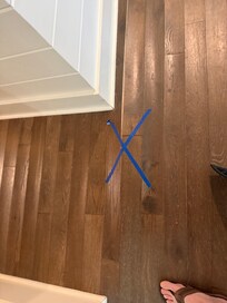 Floor buckled outside first floor B/R.