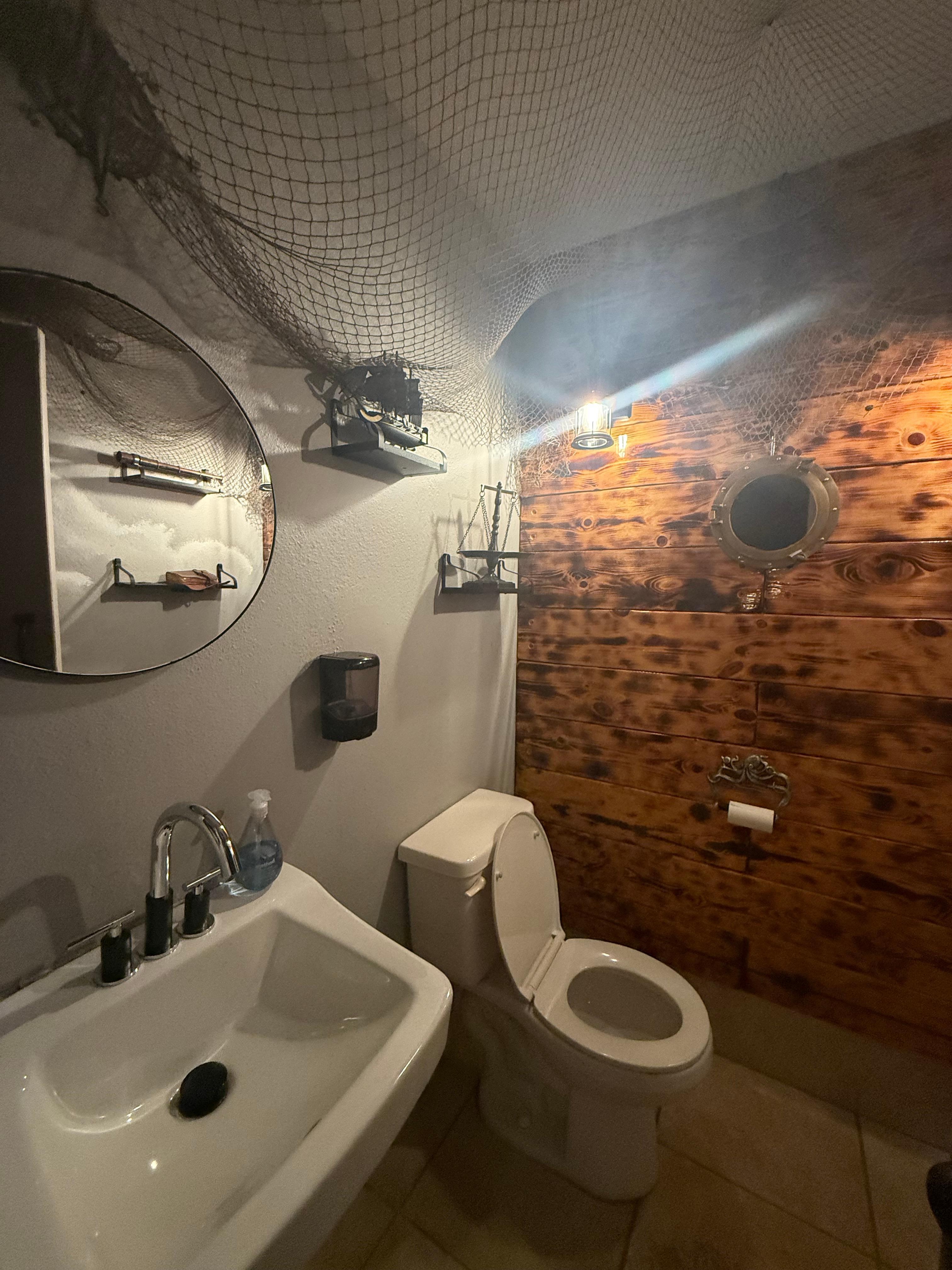 Cute poolside bathrooms for when the shower is jammed up.