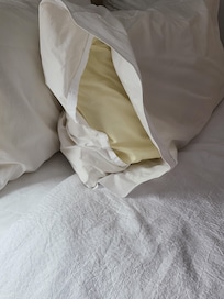 One yellowed pillow