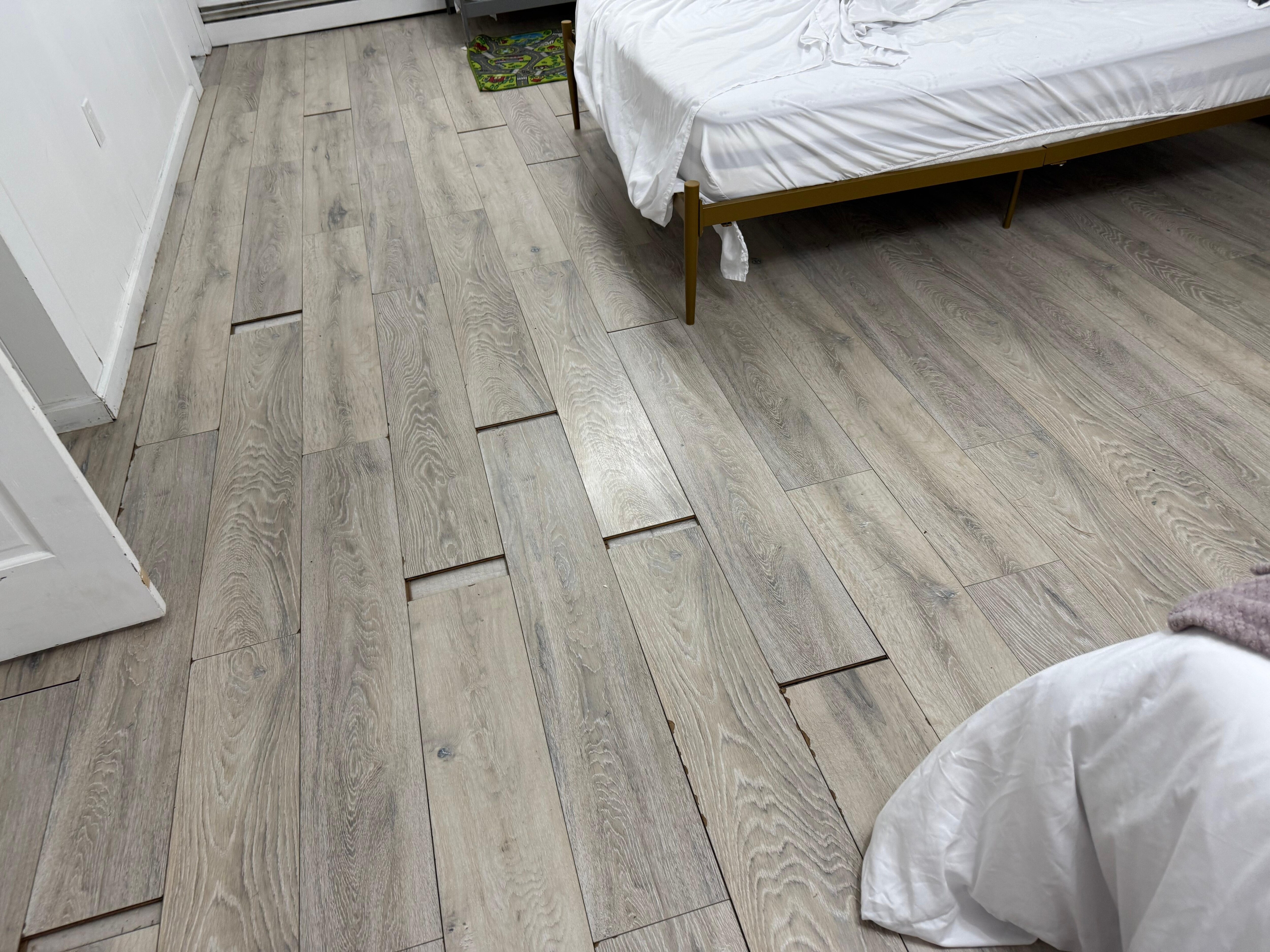 Lower level bedrooms have floor that is old and worn- separating. 