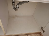 General dirt and grime under bathroom sink.