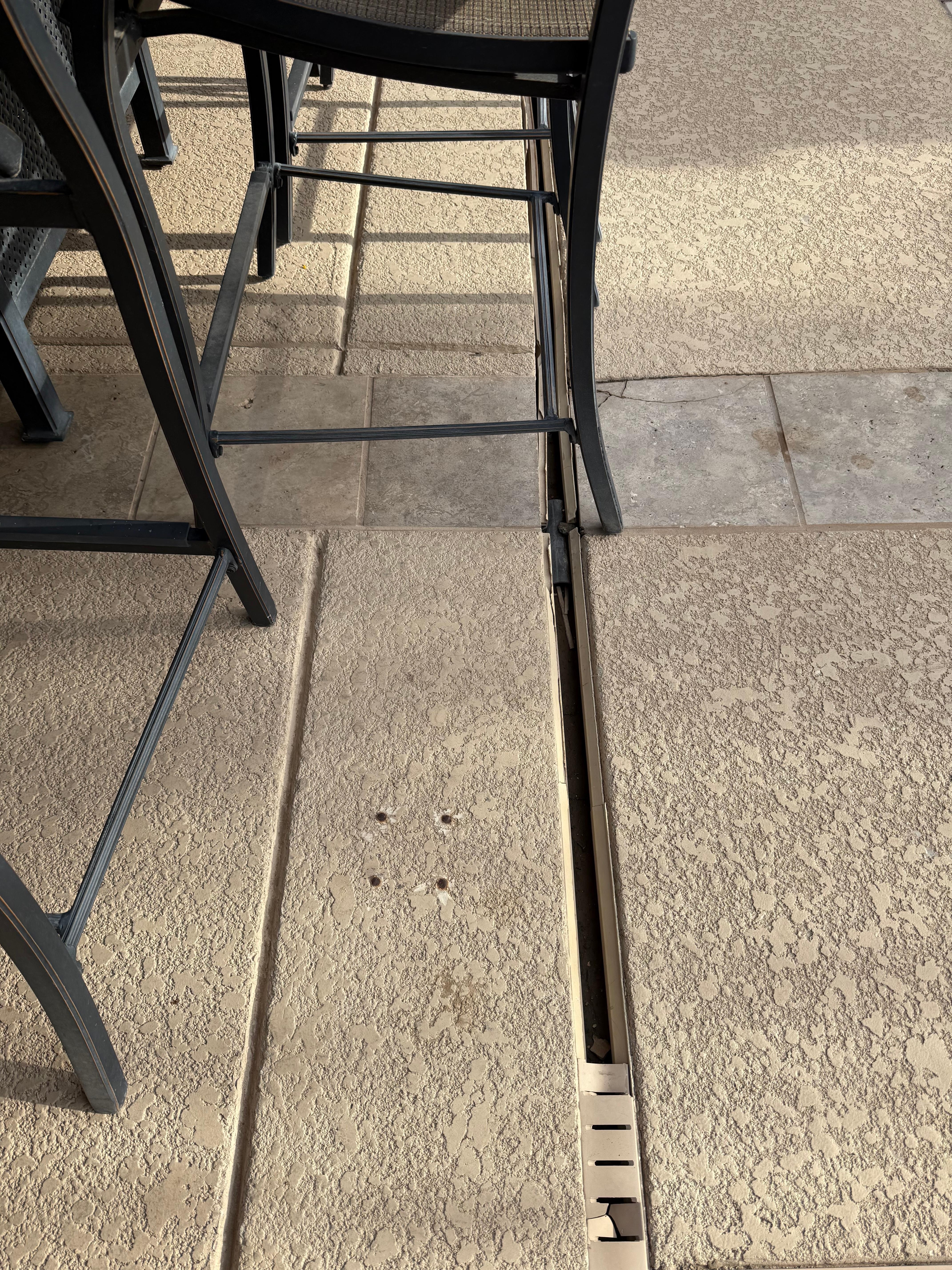 Careful with chairs on patio. Recommend replacing the drain cover for this slot.