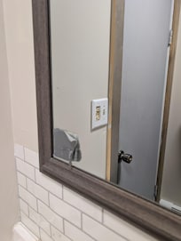 Duct tape over a break in the mirror.