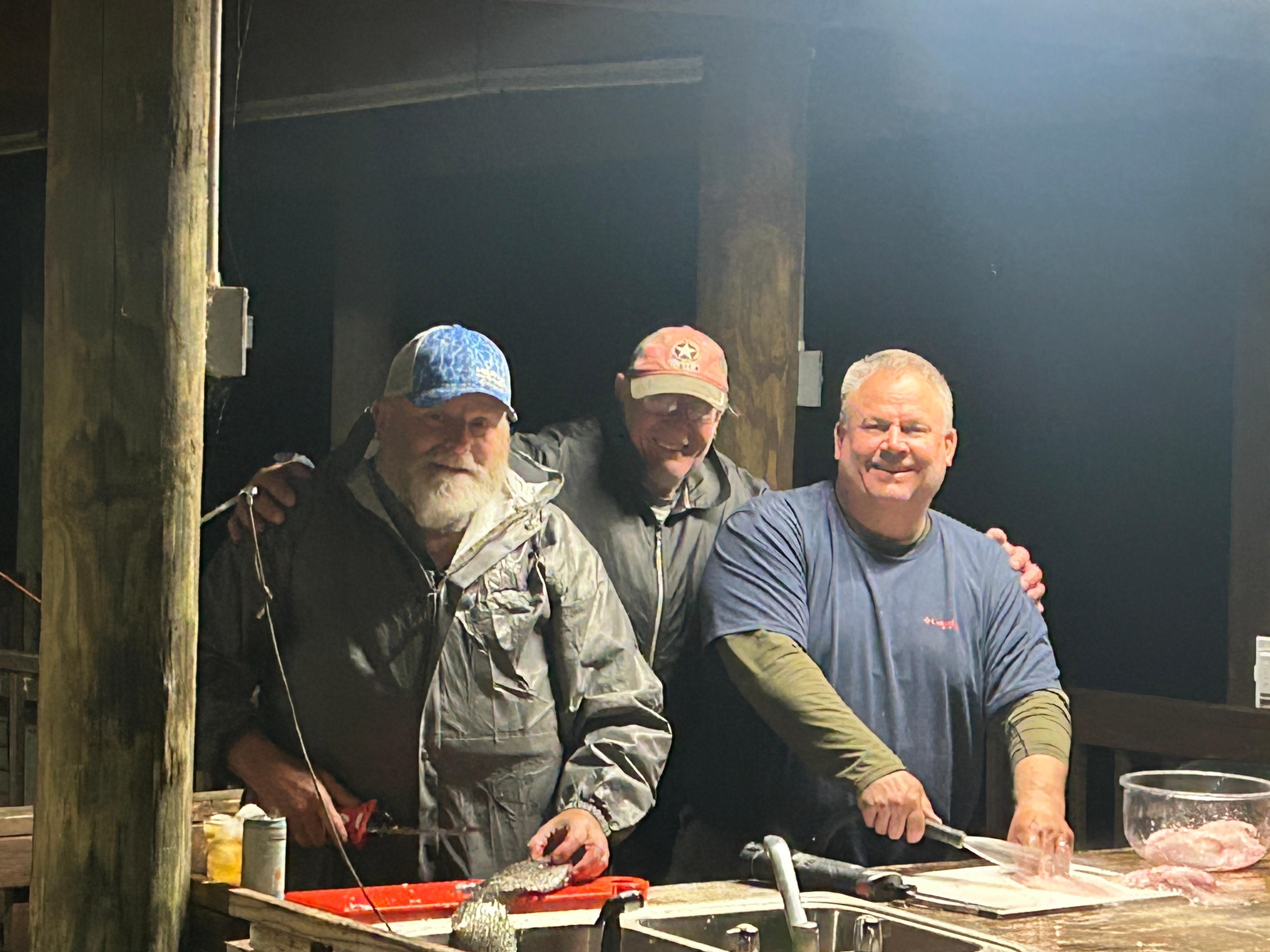 Cleaning fish at the boat house.