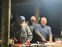 Cleaning fish at the boat house.