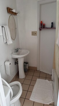 Small bathroom with very hot water.