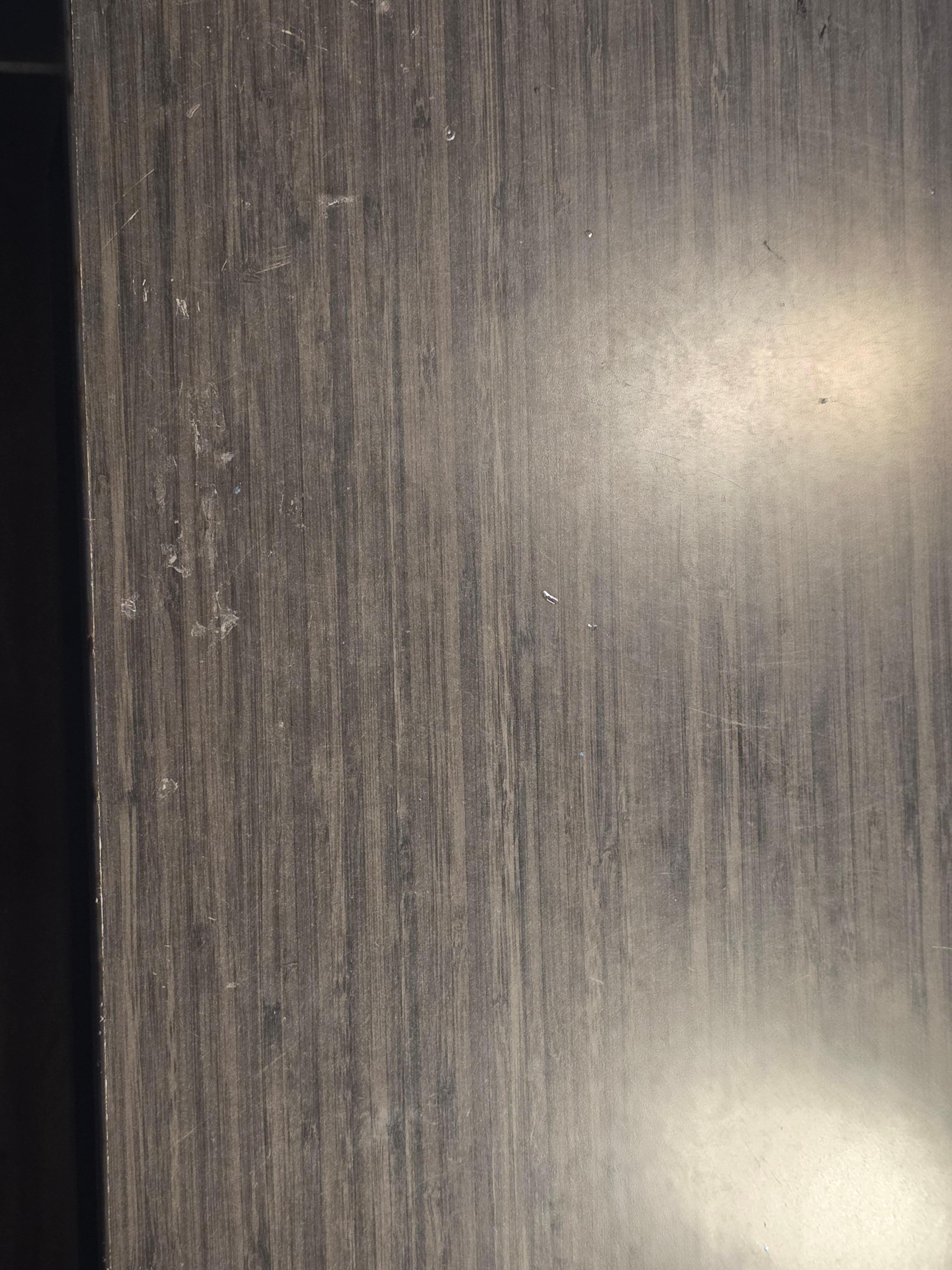 Where the night stand had glue on it