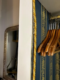 Gold trip badly glued onto basic timber furniture