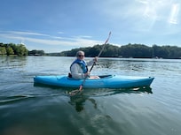 Kayaking with house in background