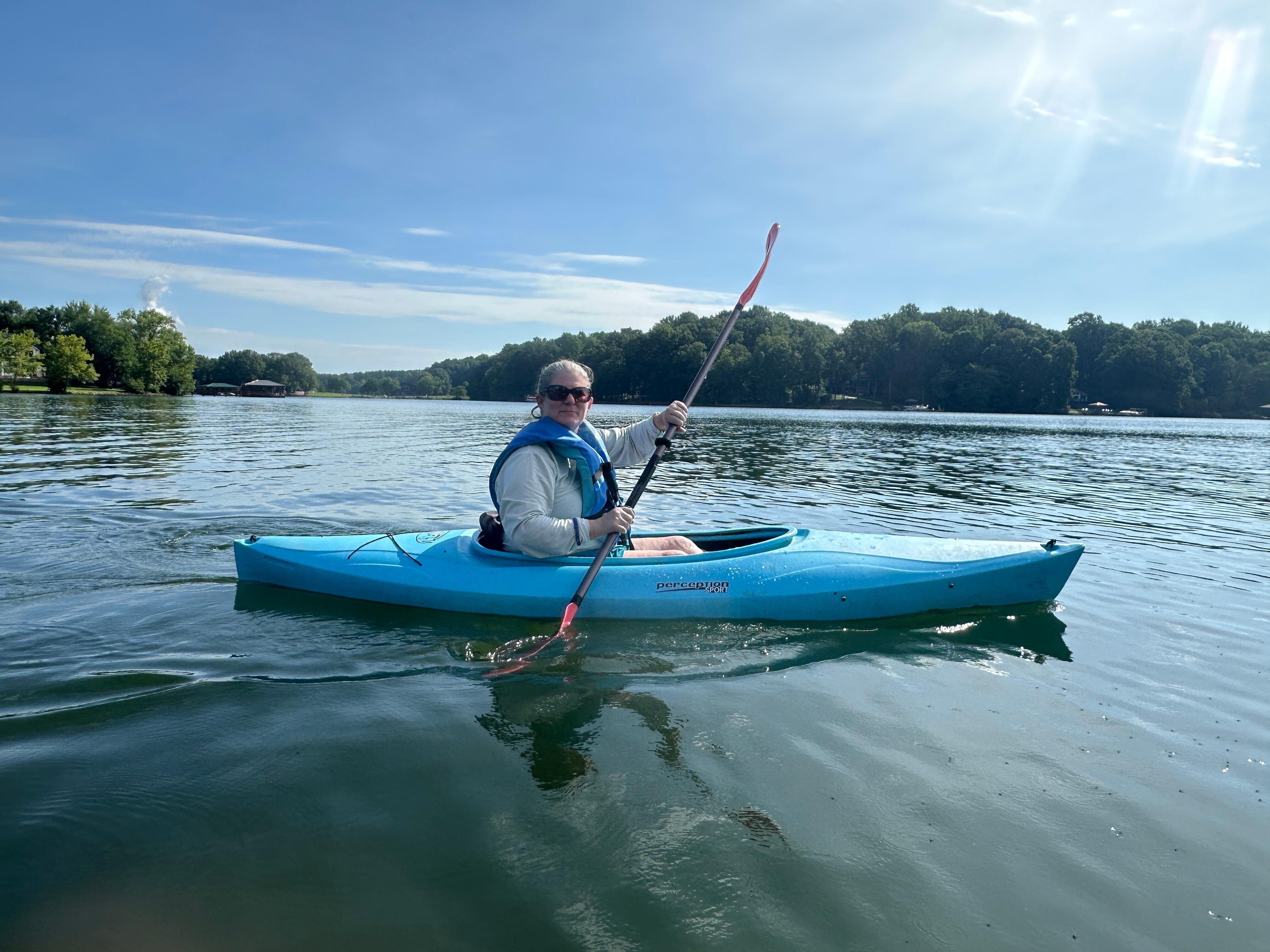 Kayaking with house in background