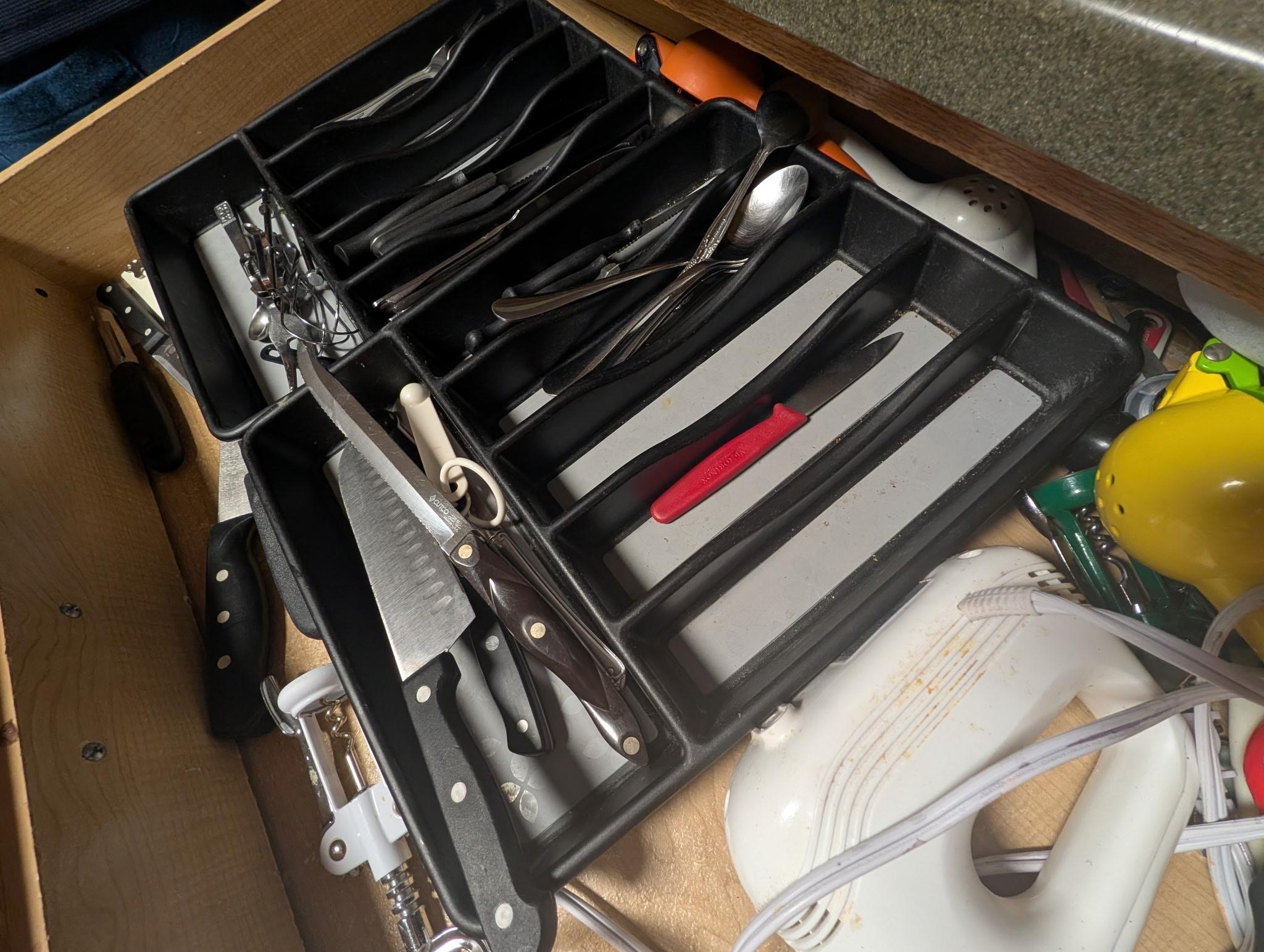 Here's the kitchen drawer, where the clean utensils are kept. Zoom in on that...