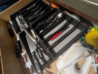 Here's the kitchen drawer, where the clean utensils are kept. Zoom in on that...