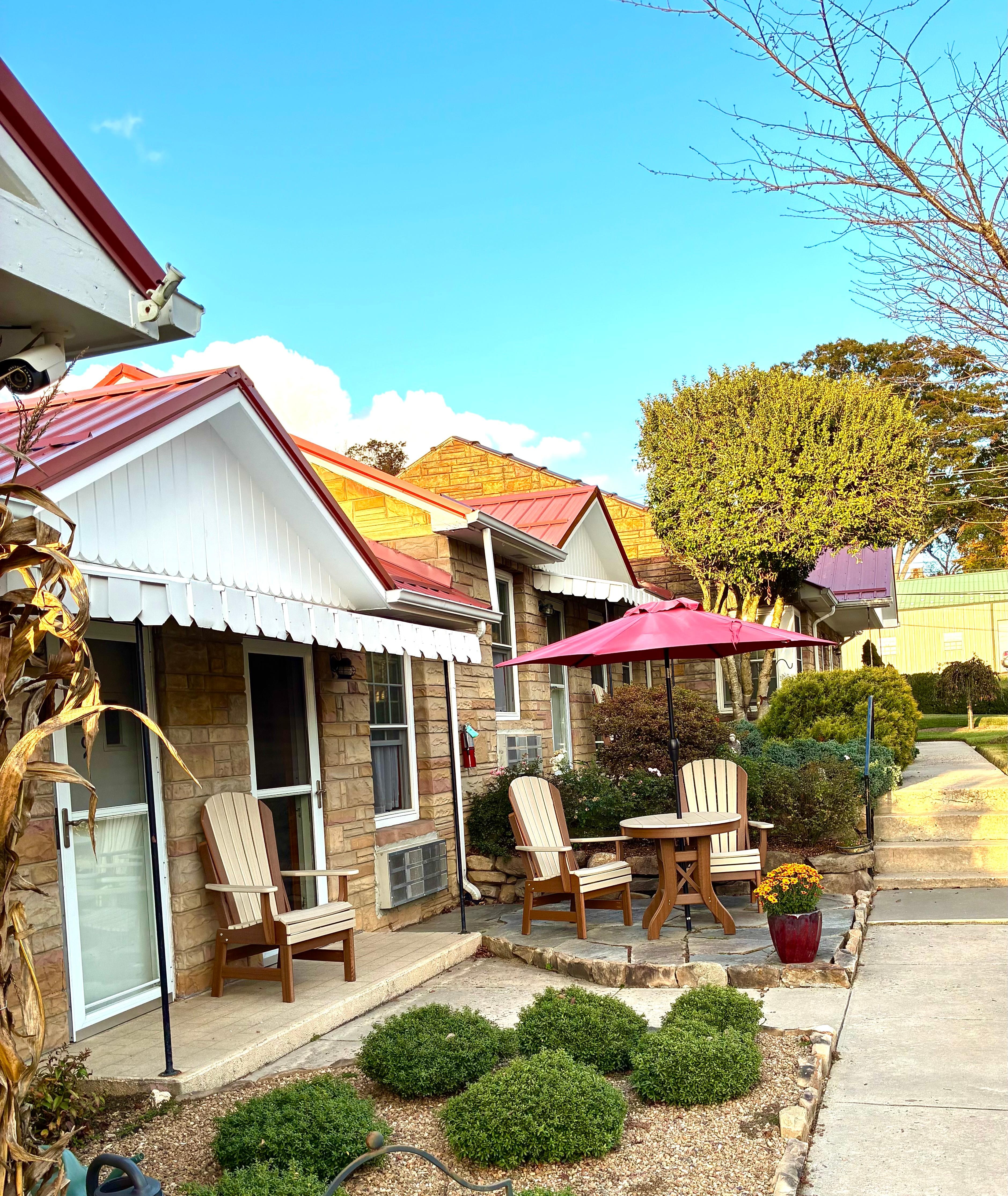 Some rooms had a little patio with umbrella and table and chairs.