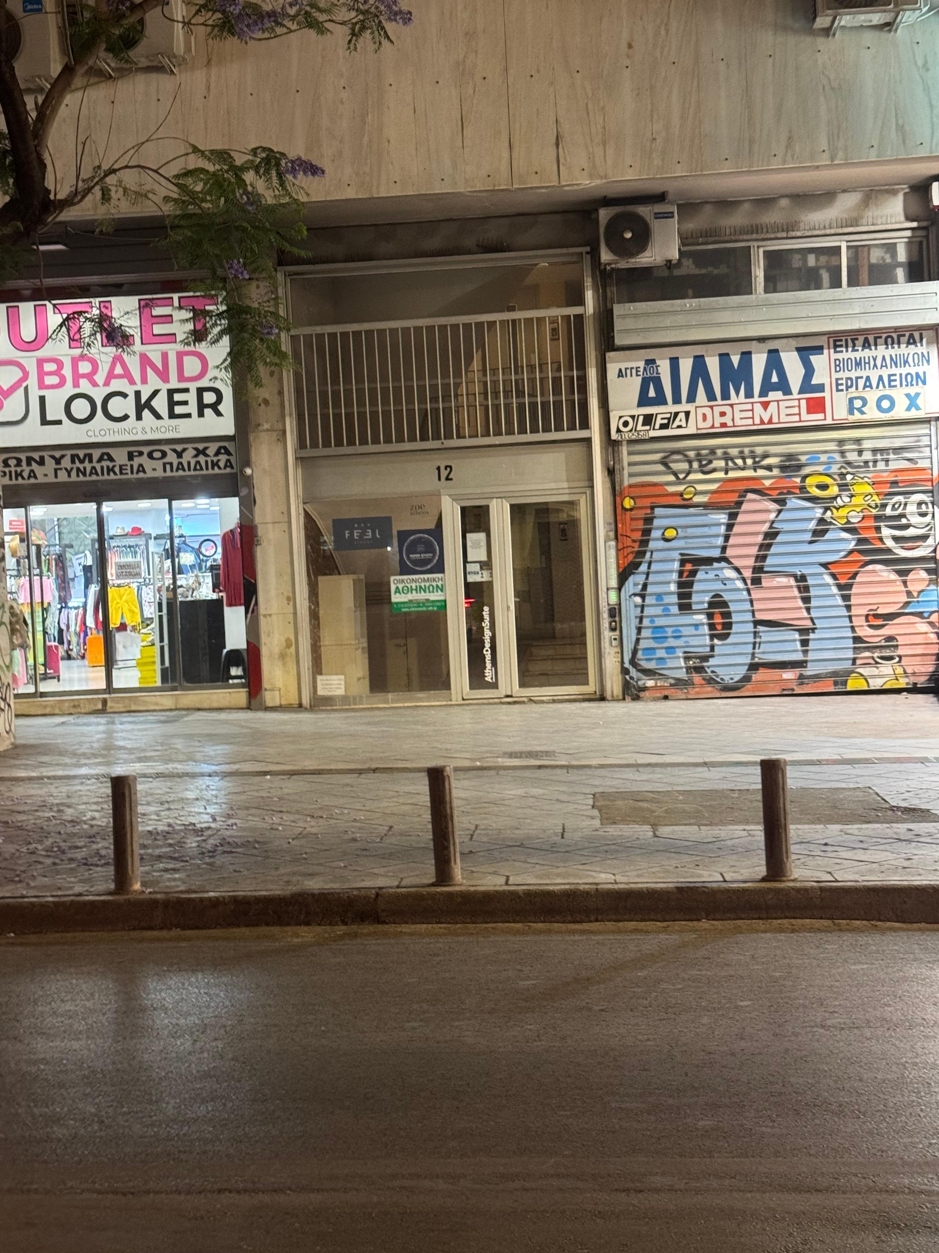 This is the entrance to the hotel. Graffiti and homeless all around.