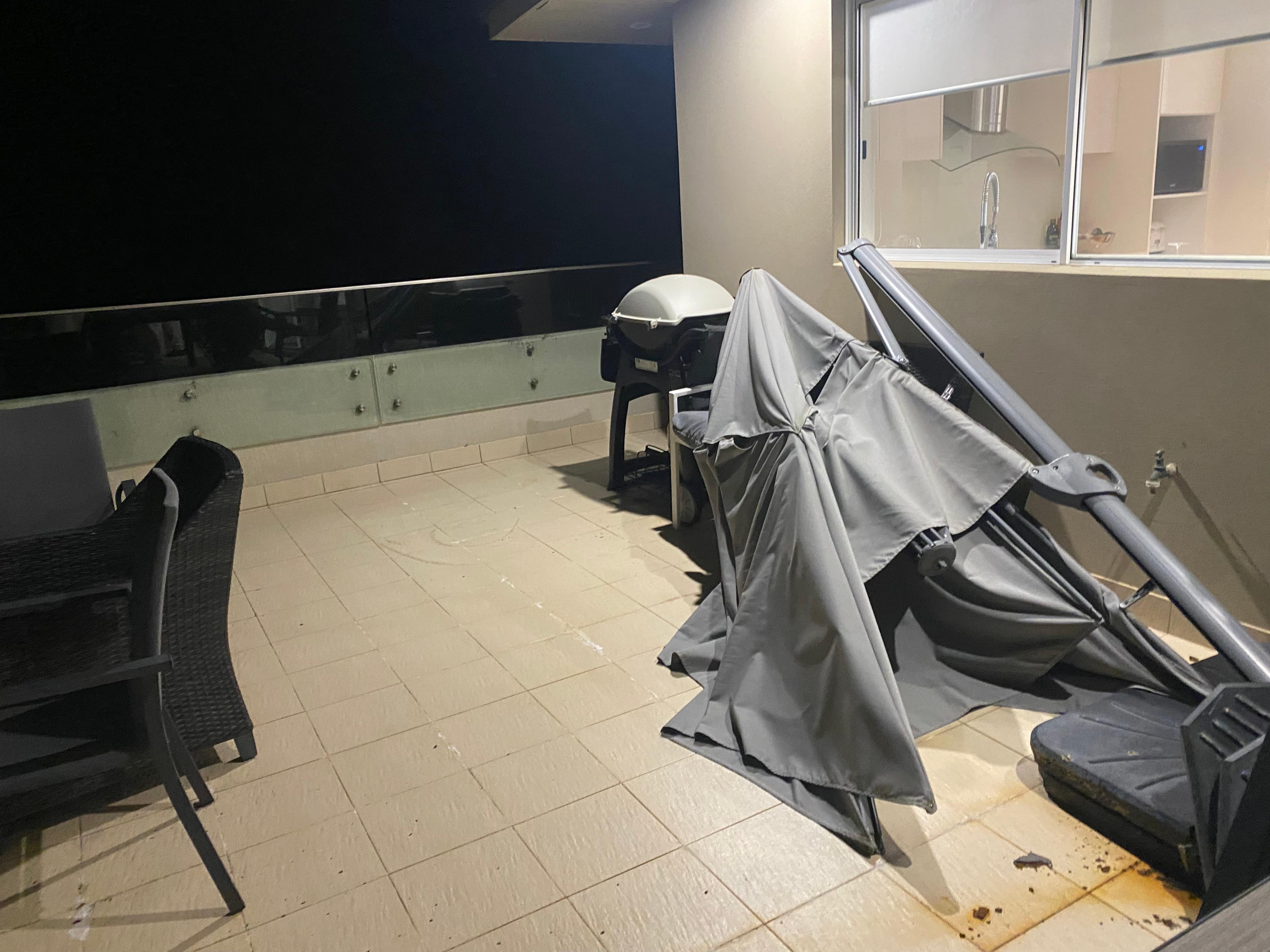 Balcony with broken umbrella