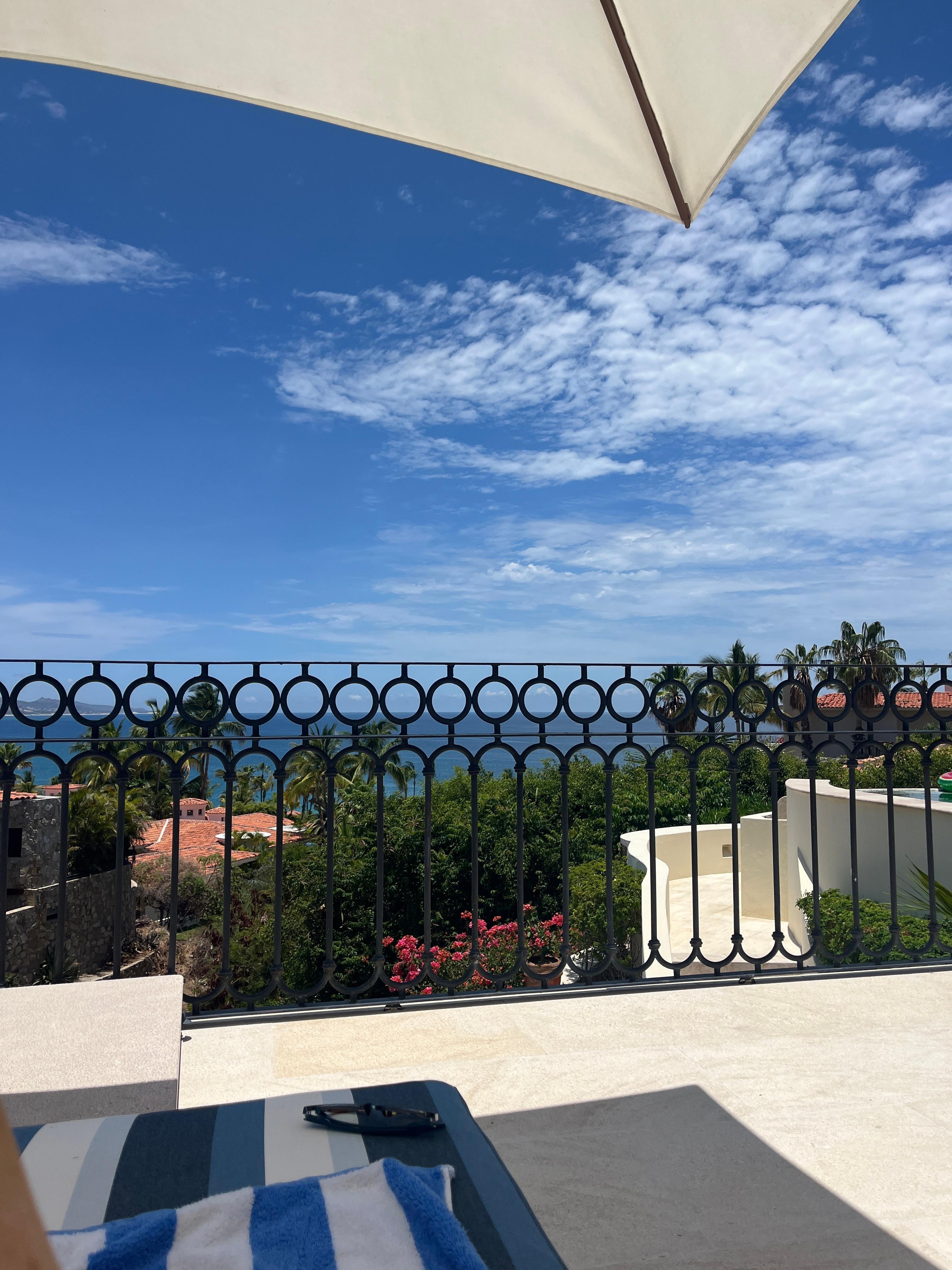 Enjoying the view from the comfy lounge chairs under the umbrella.