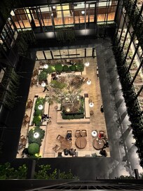 Rooms overlook a central courtyard cafe