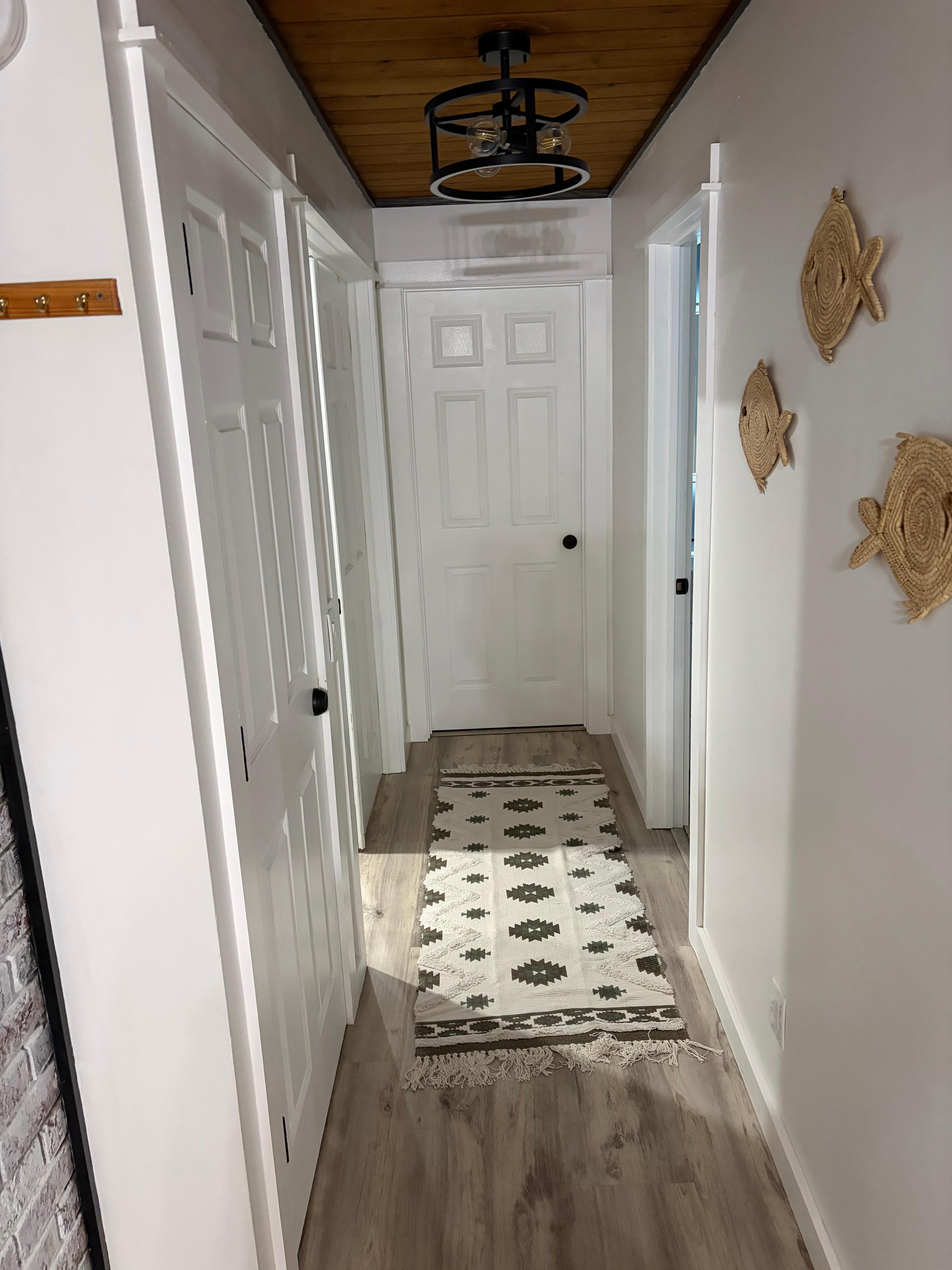 Door to left to basement laundry. Center door directly to office.