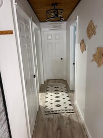 Door to left to basement laundry. Center door directly to office.