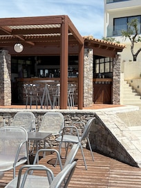 Bar at the pool and decking. To watch the sunset from here was worth finding this place