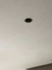 Open hold in ceiling with exposed wires