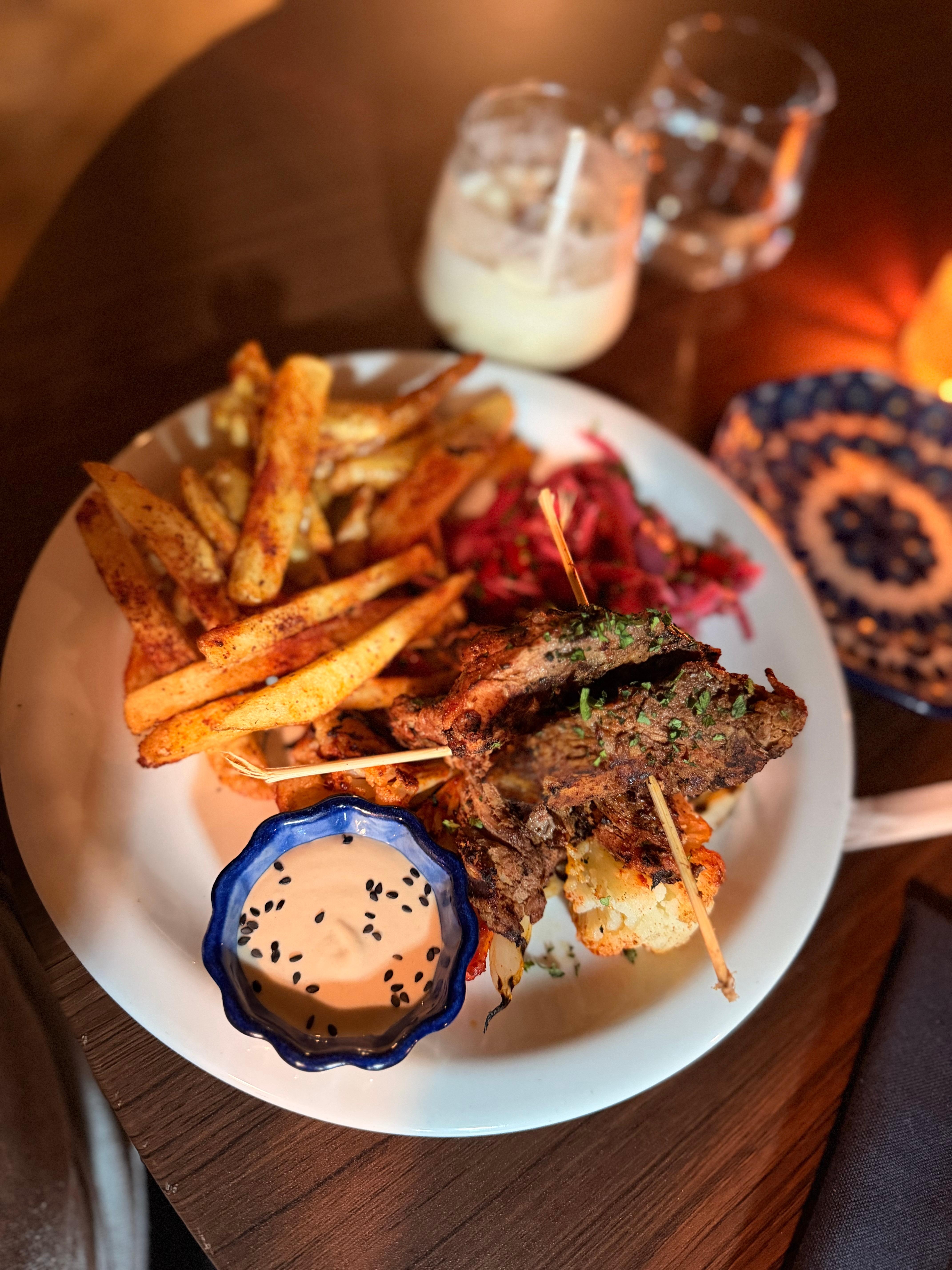 Filet mignon with fries and veggies and a sauce. 2.5/5